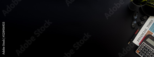 Flat lay of top view desk work table with computer tablet and financial newspapaer in Money financial concept includes copyspace for add text or graphic