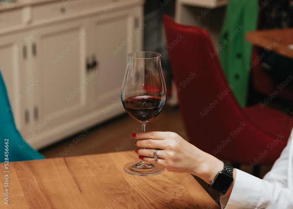Red wine by the glass at a tasting of white, rosé and red wines that celebrates friendship and joy at the highest level with your best friends on a weekend evening full of people from social media. Red wine by the glass at a tasting of white, rosé and red wines that celebrates friendship and joy at the highest level with your best friends on a weekend evening full of people from social media.