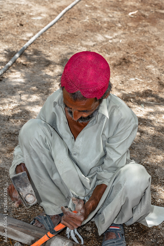 a carpenter is working and repairing a wooden door a carpenter is working and repairing a wooden door