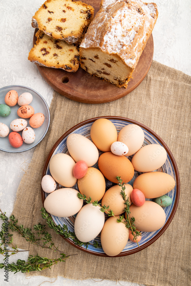 Homemade easter pie with raisins and eggs on plate on a gray concrete background. top view, close up. Homemade easter pie with raisins and eggs on plate on a gray concrete background. top view, close up.