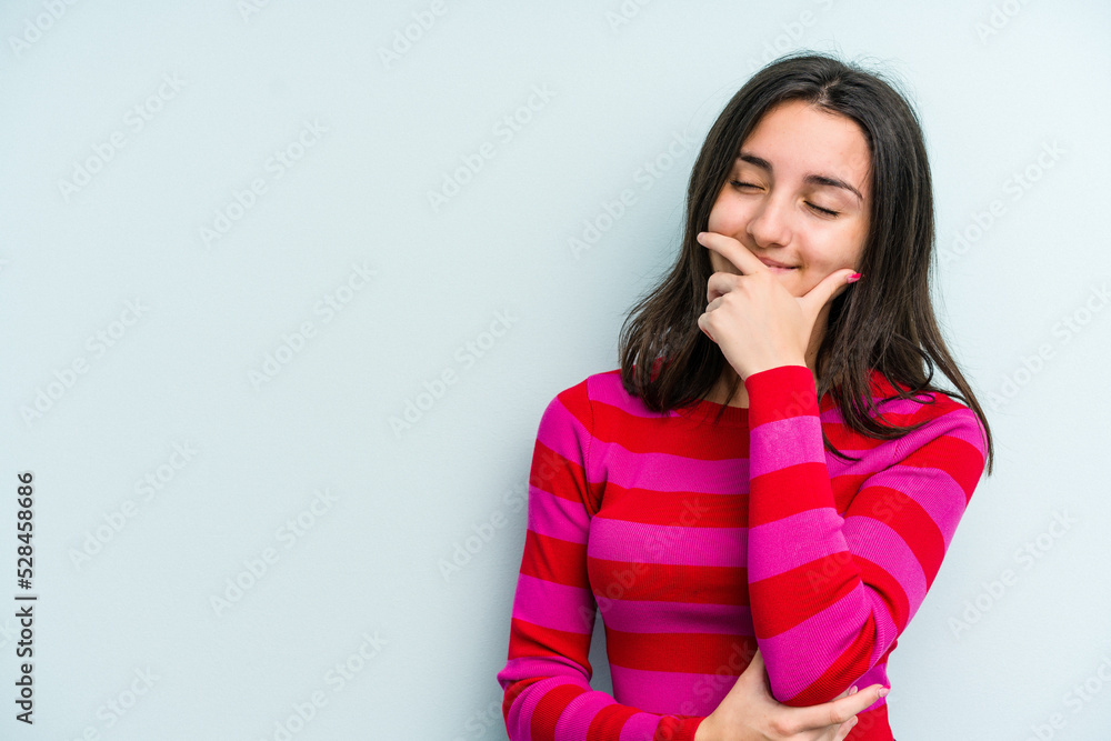Young caucasian woman isolated on blue background laughing happy, carefree, natural emotion. Young caucasian woman isolated on blue background laughing happy, carefree, natural emotion.