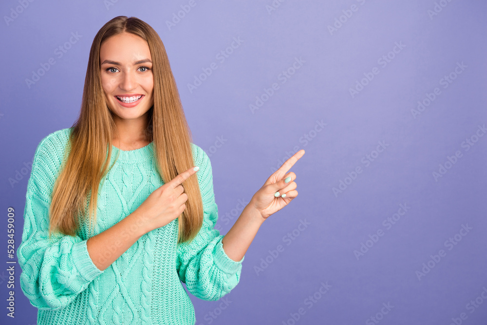Portrait of pretty positive person indicate fingers empty space advert isolated on purple color background Portrait of pretty positive person indicate fingers empty space advert isolated on purple color background