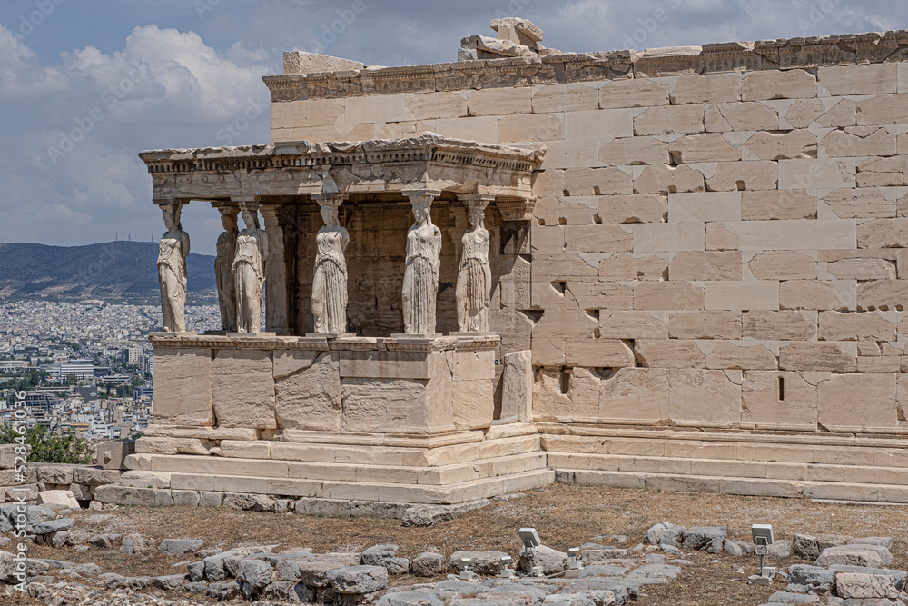 Erechtheum, the Temple of Athena Polios, an ancient Greek Ionic temple on Acropolis of Athens, dedicated to the goddess Athena, Athens, Greece Erechtheum, the Temple of Athena Polios, an ancient Greek Ionic temple on Acropolis of Athens, dedicated to the goddess Athena, Athens, Greece