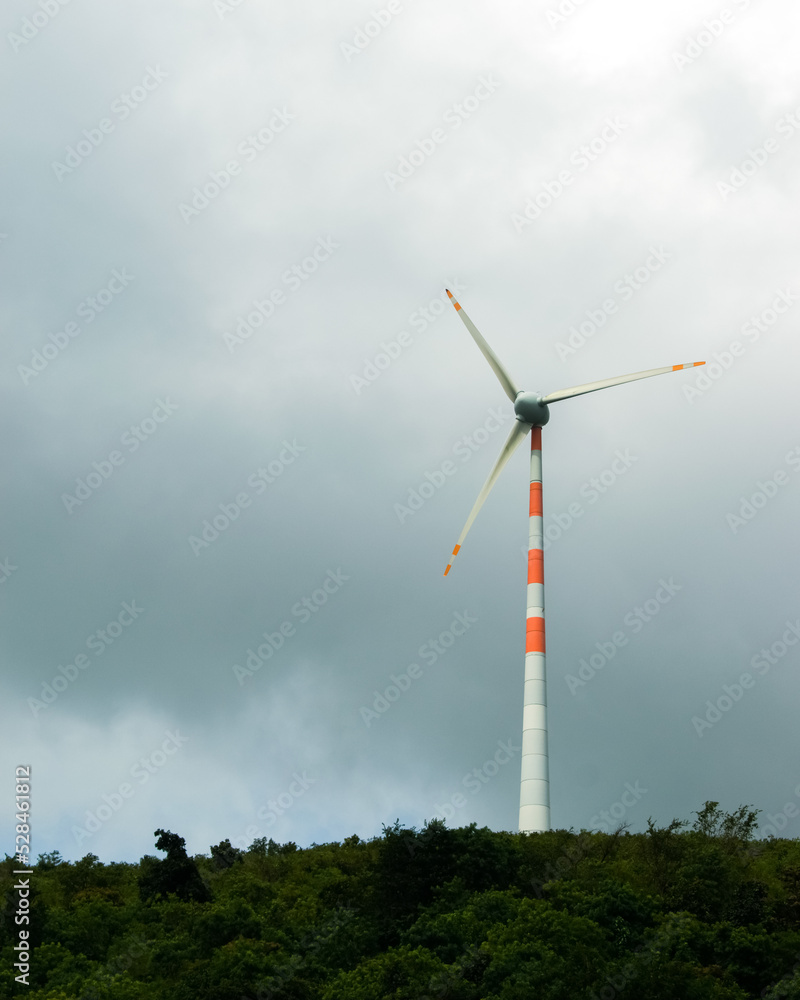 Close-up shot of wind turbine on the hill top.