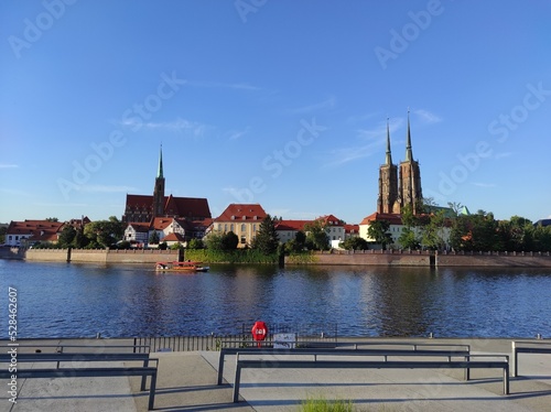 Panorama of Ostrów Tumski in Wrocław, Poland. View from the other side of the Odra River. Sunny evening in August.