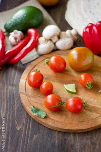 Few Cherry tomatoes on a wooden board