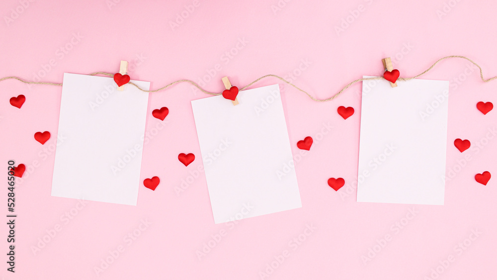 Romantic paper with copy space hanged on rope on pastel pink background. Flat lay Valentine's day Romantic paper with copy space hanged on rope on pastel pink background. Flat lay Valentine's day
