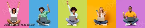 Happy glad young multiethnic people sit with laptop and credit card making success and victory gesture © Prostock-studio