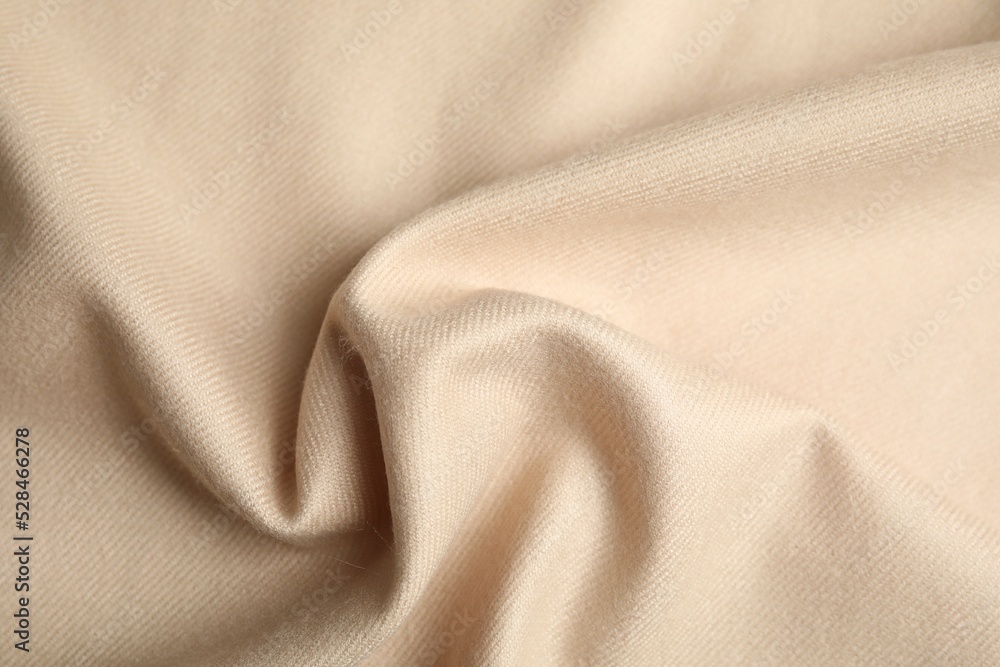 Beige soft cashmere fabric as background, closeup Beige soft cashmere fabric as background, closeup