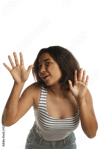 Young pretty girl, student leaned against transparent glass isolated on white color background. Close-up. Mental health, emotions concept