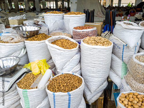 Oriental Bazaar. Almond peeled and unpeeled, nuts sales in market. Dry food, variety almonds in store. Concept of healthy eating, raw product, bazaar, diet, almond theme