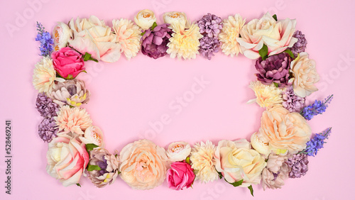 Wallpaper Mural Copy space frame made with natural spring flowers on pastel pink background. Flat lay Torontodigital.ca