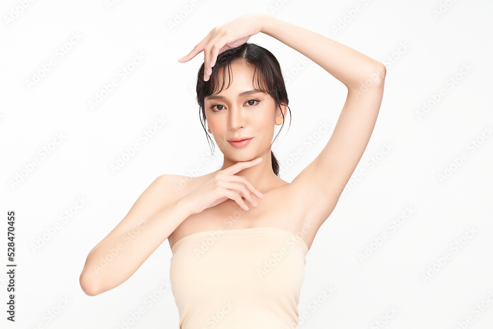 Beautiful Young Asian woman lifting hands up to show off clean and hygienic armpits or underarms on white background, Smooth armpit cleanliness and protection concept Beautiful Young Asian woman lifting hands up to show off clean and hygienic armpits or underarms on white background, Smooth armpit cleanliness and protection concept