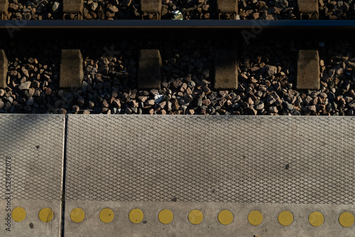 Photography Copenhagen, Denmark Train tracks and a patterned platform for safety