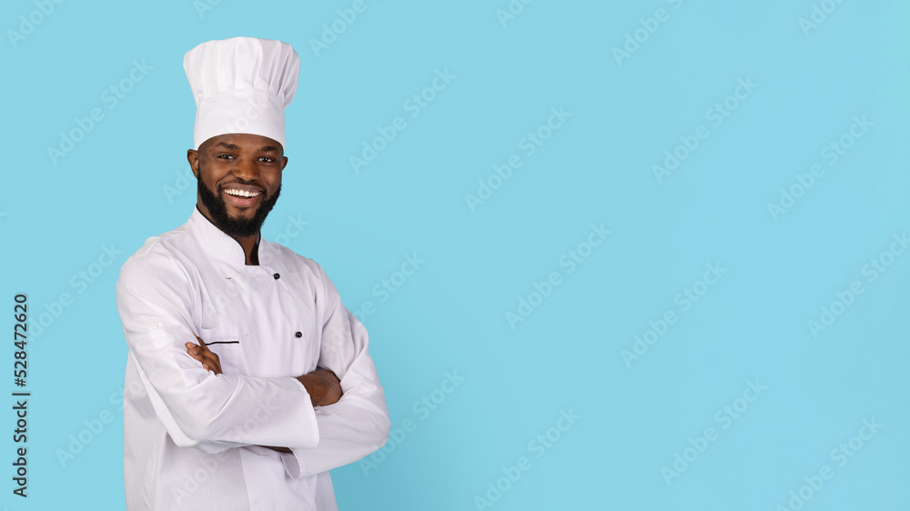 Portrait Of Smiling African American Chef Wearing Uniform Standing With Folded Arms Portrait Of Smiling African American Chef Wearing Uniform Standing With Folded Arms
