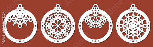Set of laser cut templates of Christmas decoration vector design. Merry Christmas balls with snowflakes for the Christmas tree. X-mas symbol for New Year decorations, paper and wood cutting, printing.