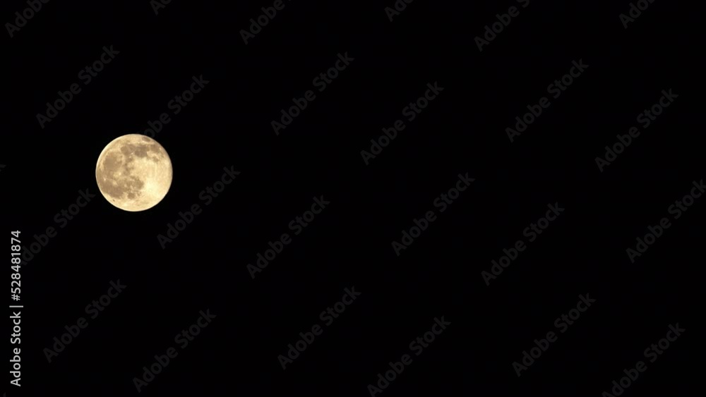 Lockdown Shot Of Full Moon Moving In Dark Sky - Los Angeles, California Lockdown Shot Of Full Moon Moving In Dark Sky - Los Angeles, California
