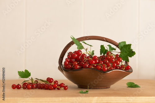 Wallpaper Mural red currant berries in a vase on a wooden table Torontodigital.ca