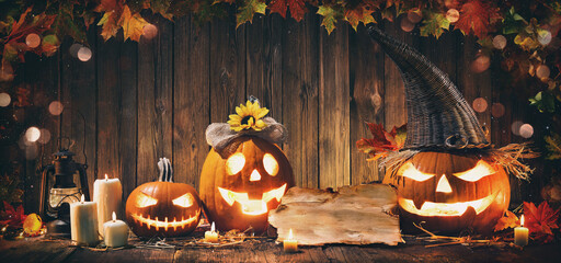 Holiday background with glowing halloween pumpkin Jack O'Lantern