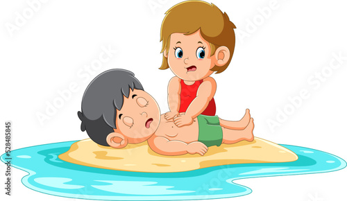 The girl is pumping boy's heart to save him on the beach