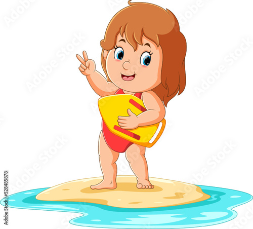 The girl is standing on the beach water and posing cutely