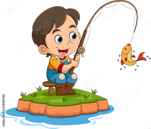 The little boy is fishing in the river and succeed to get small fish with the rod