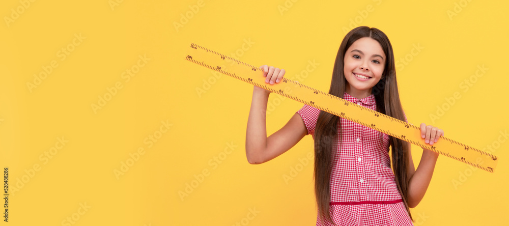 happy teen girl study math in school hold ruler, education. Banner of school girl student. Schoolgirl pupil portrait with copy space. happy teen girl study math in school hold ruler, education. Banner of school girl student. Schoolgirl pupil portrait with copy space.