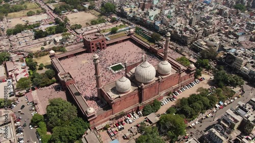 4k Aerial drone shot of muslim peope praying at mosque , masjid on friday  in New  delhi capital of india jama masjid ,fatehuri masjid , jamia millia ,islamia chandni chowk charwi bazaar old delhi  photo