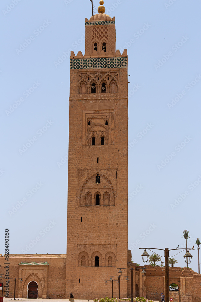 Koutoubia famous mosque ancient tower landmark in Marrakesh, Morocco on a blue sunny sky