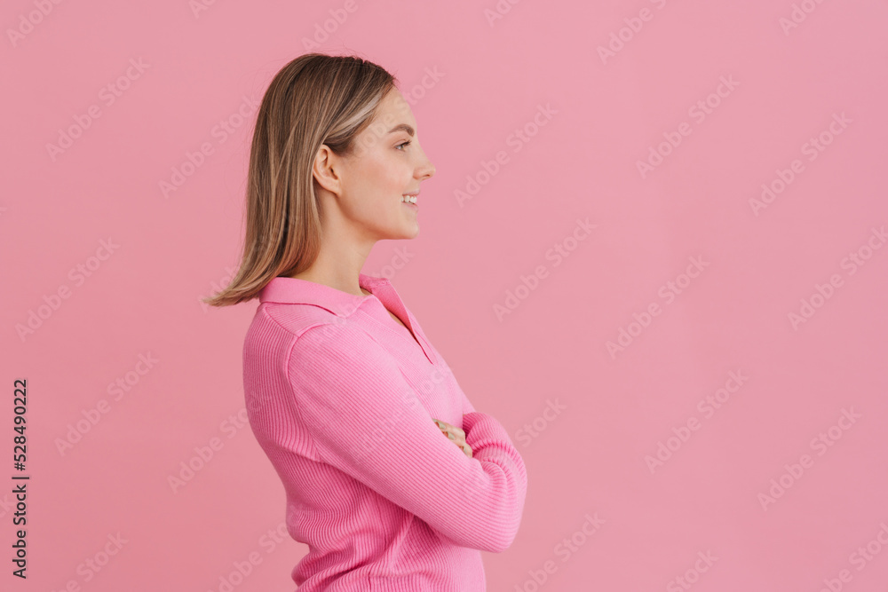 Young beautiful smiling girl with folded arms Young beautiful smiling girl with folded arms