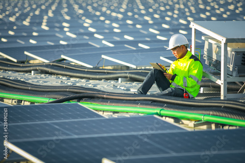 Wallpaper Mural Portrait of professional man engineer working checking the panels at solar energy on buoy floating. Power plant with water, renewable energy source. Eco technology for electric power in industry. Torontodigital.ca