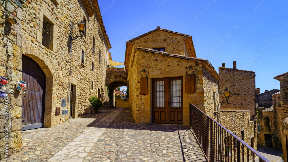 Houses built with stone in the picturesque medieval village of Pals, Girona, Catalonia.