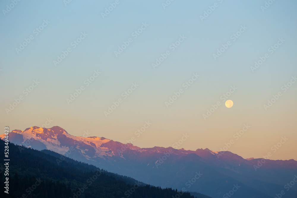 mountain landscape with moon on blue sky