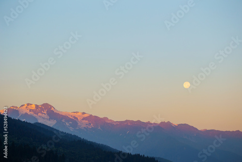 mountain landscape with moon on blue sky