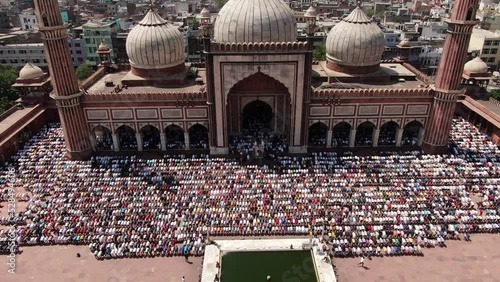 4k Aerial drone shot of muslim peope praying at mosque , masjid on friday  in New  delhi capital of india jama masjid ,fatehuri masjid , jamia millia ,islamia chandni chowk charwi bazaar old delhi  photo