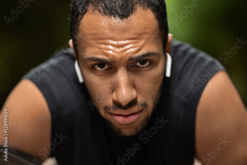 Closeup portrait of exhausted african american sportsman