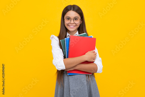 School child with book. Learning and education. Happy schoolgirl face, positive and smiling emotions.
