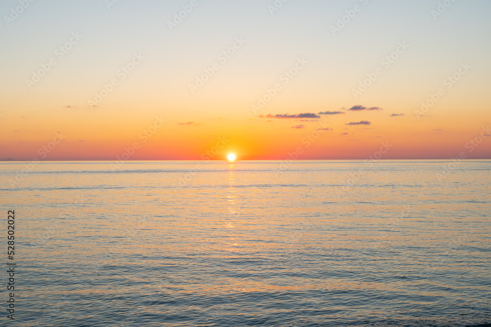 Sunset over the Black Sea. Beautiful seascape from the shore.