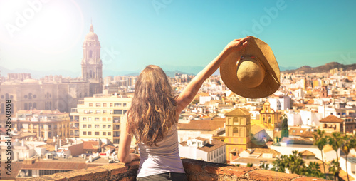 Woman looking at panoramic view of Malaga- Andalusia in Spain