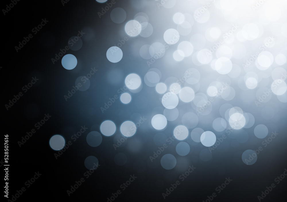 illuminated light blue and white defocus lights on a black background illuminated light blue and white defocus lights on a black background