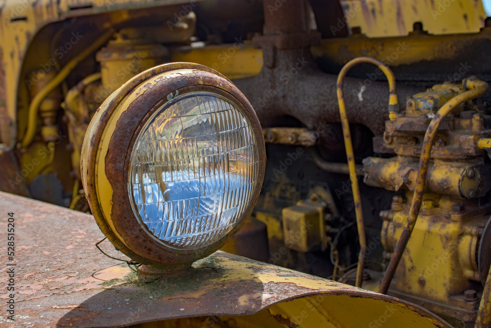 Equipment on display at the NY Steam Engine Association Pageant of Steam in Canandaigua in Upstate NY. Round headlight on Construction Machinery. Equipment on display at the NY Steam Engine Association Pageant of Steam in Canandaigua in Upstate NY. Round headlight on Construction Machinery.