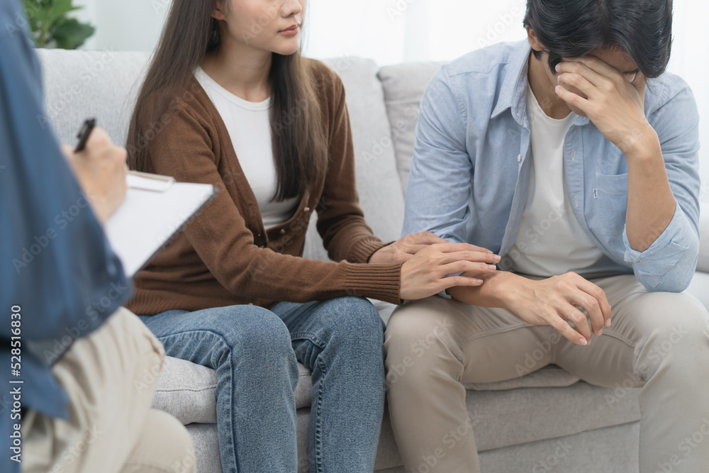 couple relationship therapy with a counselor. Close Up hands of the woman client during a conversation with psychologist to find problems and solution. couple relationship therapy with a counselor. Close Up hands of the woman client during a conversation with psychologist to find problems and solution.