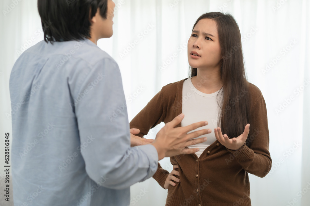 Family problems, Asian couple quarrel together at home. woman angry on man and man feel annoy. Family problems, Asian couple quarrel together at home. woman angry on man and man feel annoy.