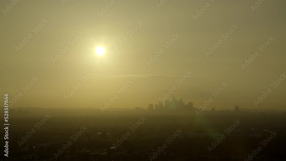 Aerial Lockdown Silhouette Of Buildings Against Sky In City During Sunset - Los Angeles, California Aerial Lockdown Silhouette Of Buildings Against Sky In City During Sunset - Los Angeles, California