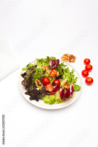 top view of vegan vegetable salad on white background