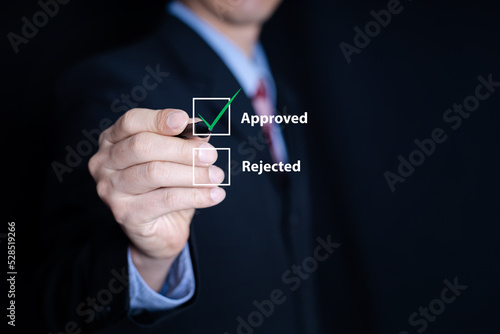 business man choose approved checking box