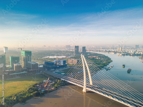 Aerial view of Ho Chi Minh City skyline and skyscrapers on Saigon river, center of heart business at downtown. Morning view. Far away is Landmark 81 skyscraper