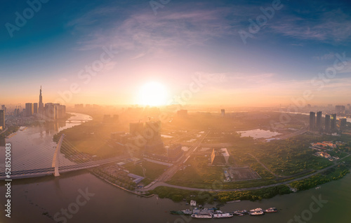 Aerial view of Ho Chi Minh City skyline and skyscrapers on Saigon river, center of heart business at downtown. Morning view. Far away is Landmark 81 skyscraper