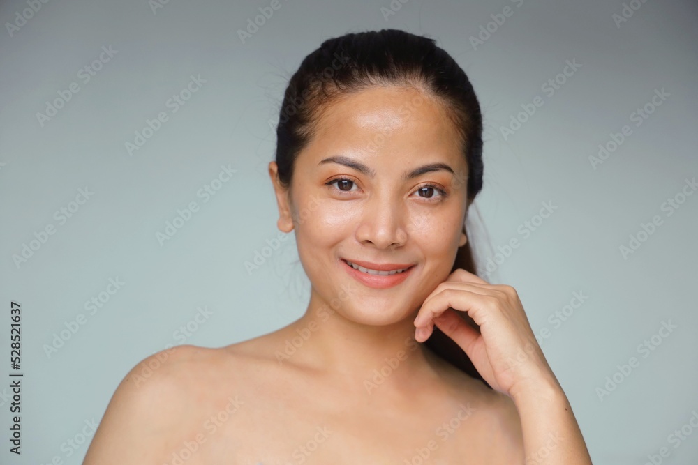 Beautiful Asian woman with natural makeup, facial treatment spa and beauty, Smiling beautiful woman standing over isolated background with copy space. Beautiful Asian woman with natural makeup, facial treatment spa and beauty, Smiling beautiful woman standing over isolated background with copy space.