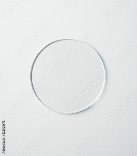 Round glass shape isolated on white background.